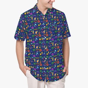 May include: A short-sleeve button-down shirt in a dark blue fabric featuring a repeating pattern of pixelated arcade cabinets, game controllers, palm trees, tropical flowers, surfboards, and cocktails with the text Aloha Retro Arcade.