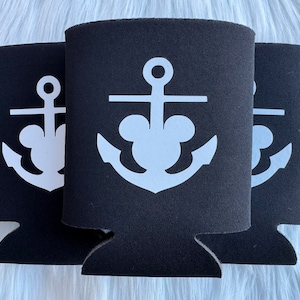 May include: Three black neoprene can coolers with a white anchor design featuring Mickey Mouse ears.