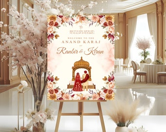 May include: A wedding welcome sign with a floral border and a watercolor illustration of a couple in traditional Indian wedding attire. The sign reads "Welcome to the Anand Karaj of Ranbir & Kiran".