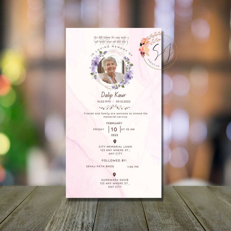 May include: A pink and white marble-textured memorial card with a photo of a woman in a floral wreath. The card includes the text "In Loving Memory of Dalip Kaur 14.02.1970 - 09.12.2022" and details for a memorial service on February 10, 2023 at 10 AM at City Memorial Lawn, 123 Any Where St., Any City, followed by a Sehaj Path Bhog at 1:00 PM at Gurdwara Sahib, 123 Any Where St., Any City.