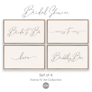 May include: Set of four printable signs with calligraphy text for a bridal shower. The signs say "Bride to Be", "Miss to Mrs", "Love", and "Bubbly Bar".