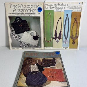 May include: Three vintage macrame pattern books. The covers feature images of macrame purses and necklaces. Titles include "The Macrame Pursemaker", "Macrame Fashions for New Seasons", and "Purse Strings".