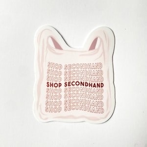 May include: A sticker in the shape of a plastic shopping bag. The bag is light pink with darker pink handles. The words "SHOP SECONDHAND" are printed repeatedly in a wavy pattern in red.