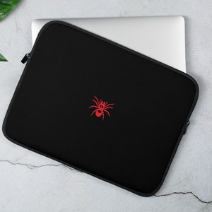 Spin! Rood op zwarte laptophoes