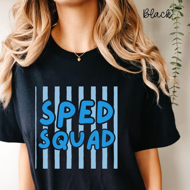 May include: A black short-sleeved t-shirt featuring a graphic design with vertical light blue stripes and the text "SPED SQUAD" in bold, rounded blue letters. The shirt has a crew neckline and a solid black background color throughout.