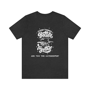 May include: Dark heather grey t-shirt with a white graphic design. The graphic features two hands clasped together with the text "Everything's Better When We're Together" and "Are You The Gatekeeper?"