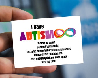 May include: A white card with the text "I have AUTISMO" in rainbow colors and an infinity symbol. The card also includes the text "Please be calm! I am not being rude. I may be nonverbal or uncommunicative. Please avoid touching me. I may need a quiet and dark space. Give me time."