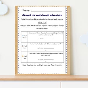 May include: A framed worksheet titled "Around the world math adventure" with math problems. The worksheet includes questions about buying croissants, sushi rolls, and a camel's travel distance. The worksheet is on a wooden shelf.