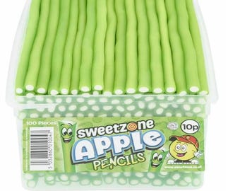 May include: A clear plastic container filled with 100 green and white apple-flavored candy pencils. The container has a label that says "Sweetzone Apple Pencils" and "10p".