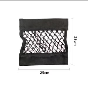 May include: Black car storage net, 9.8 inches wide and 9.8 inches high. The net is made of a woven mesh material and is framed by a solid black border. The dimensions are clearly labeled on the image.