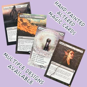 May include: Hand-painted altered Magic cards with multiple designs available. The image shows four cards with custom artwork. The cards feature fantasy art with a variety of colors and styles, including angels and portraits.