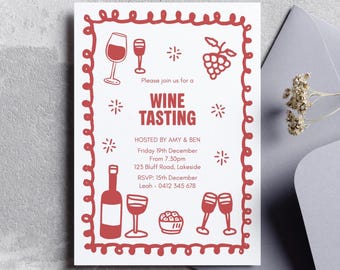 May include: A white invitation card with a red border and wine-themed illustrations. The text reads "Wine Tasting," with event details including date, time, and RSVP information. The card is accompanied by a gray envelope.