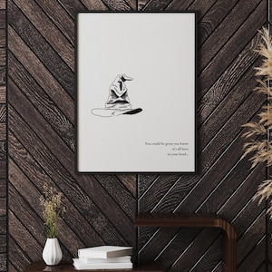 May include: Black and white illustration of the Sorting Hat from the Harry Potter series. The hat is sitting on a white background with the text "You could be great you know, it's all here in your head."