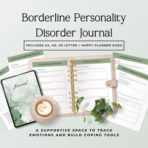 May include: A journal titled "Borderline Personality Disorder Journal" with the text "Includes A4, A5, US Letter + Happy Planner Sizes". The journal is open, with pages visible. A tablet and a cup of coffee are next to the journal.