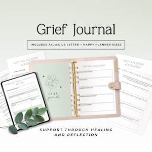 May include: A Grief Journal with the text "Grief Journal" and "Includes A4, A5, US Letter + Happy Planner Sizes". The journal is open, showing lined pages and a design. Additional pages and a tablet are also visible.