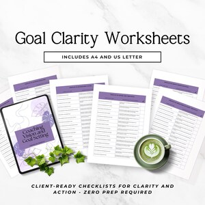 May include: A set of Goal Clarity Worksheets featuring purple headers and checklists. The collection includes a tablet displaying Coaching Vision and Goal Setting text, multiple printed pages, and a green ceramic cup of latte art coffee.