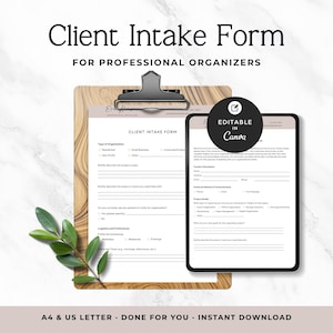 May include: A Client Intake Form for professional organizers on a wooden clipboard with a tablet displaying the same document. The form includes sections for contact information, project details, and logistics. A small green leafy sprig is present.