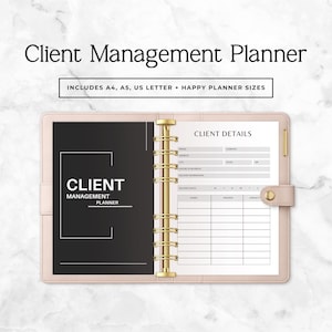 May include: A light pink ring-bound planner with a gold metal spine. The left page is black with white text reading Client Management Planner. The right page is a white Client Details form with fields for contact information and a table for names.