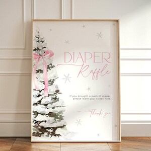 May include: A white sign with a pink watercolor tree and a pink ribbon. The sign says "DIAPER Raffle" and "If you brought a pack of diaper please leave your ticket here." It also says "Thank you".