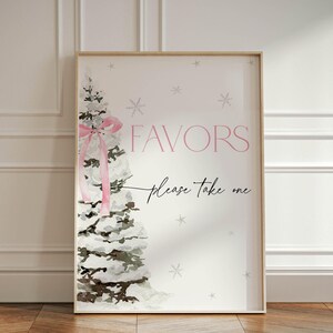 May include: A white sign with a watercolor illustration of a snowy pine tree with a pink bow. The sign says "Favors" and "Please take one" in black script.