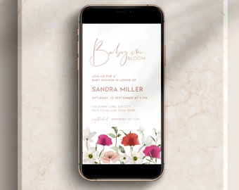May include: A smartphone mockup with a baby shower invitation. The invitation is for Sandra Miller and has a floral design with the text "Baby in Bloom".