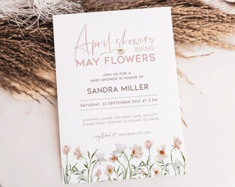 May include: A white baby shower invitation with pink calligraphy that reads "April showers bring May flowers". The invitation includes details for a baby shower in honor of Sandra Miller on September 22nd at 2 PM. The invitation features a floral design with pink and white flowers.