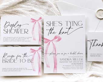 May include: Four white cards with pink watercolor ribbon designs. The cards are for a bridal shower and include the text "Display Shower", "Recipe for the Bride-to-Be", "She's Tying the Knot", and "Thank You".