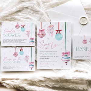 May include: A set of four printable cards for a bridal shower with a winter theme. The cards feature a watercolor illustration of pink and blue ornaments with snowflakes and the text "Display Shower", "Recipe for the Bride-to-Be", "Snow in Love", and "Thank You".
