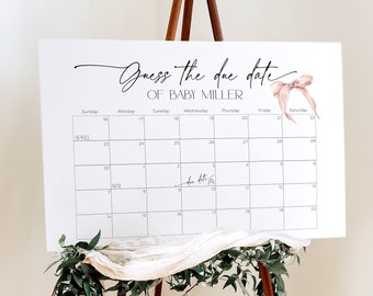 May include: A white sign on a wooden easel with the text "Guess the due date of BABY MILLER" in black script. A pink bow graphic is on the right. A calendar grid is below, with the months of April and May visible. Greenery and white fabric decorate the easel.