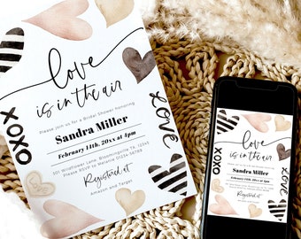 Puede incluir: Una invitación de despedida de soltera blanca con corazones rayados en blanco y negro, corazones de acuarela marrón y rosa y el texto "love is in the air". La invitación es para Sandra Miller e incluye la fecha, la hora y el lugar de la despedida de soltera. La invitación también incluye el texto "Registered at Amazon and Target".