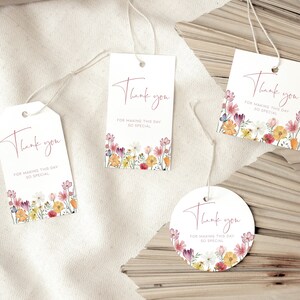 May include: Four white gift tags with a floral design and the text "Thank you for making this day so special".