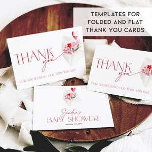 May include: Three printable thank you cards with a watercolor design of a pink and red origami flower with a heart. The text on the cards reads "Thank you for showering our baby with love".