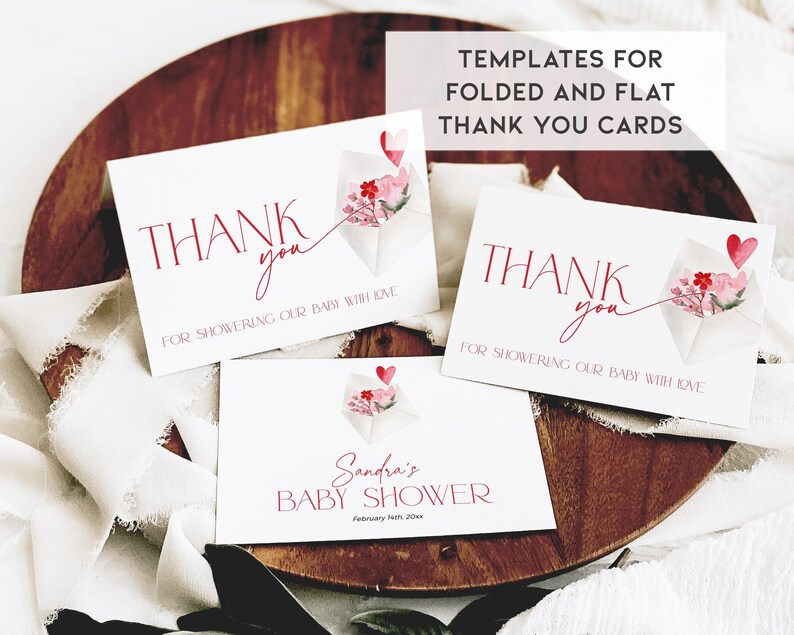 May include: Three printable thank you cards with a watercolor design of a pink and red origami flower with a heart. The text on the cards reads "Thank you for showering our baby with love".