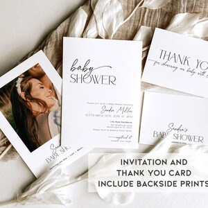 May include: A set of two printable cards for a baby shower. The invitation card features a simple design with the text "baby shower" in a script font. The thank you card features the text "Thank you for showering our baby with love".
