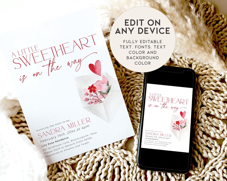 May include: A pink and red watercolour illustration of a heart and flowers in an envelope. The text "A Little Sweetheart is on the way" is written in a red script font. The text "Sandra Miller" is written in a black font. The text "February 14th, 20xx at 4pm" is written in a black font. The text "Lilly Rose Residence" is written in a black font. The text "301 Wildflower Lane, Bloomingville Texas" is written in a black font. The text "Please RSVP to Melanie 01234-56789" is written in a black font. The text "Registered at Amazon and Target" is written in a black font.