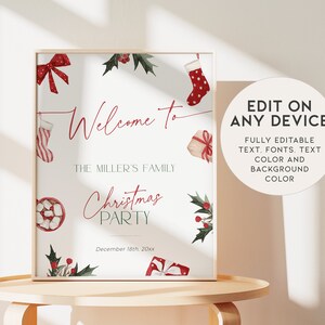 May include: A framed Christmas party sign with watercolor illustrations of holiday elements. The sign reads "Welcome to The Miller's Family Christmas Party" in red script. Additional text on the sign includes the date and details about editing the sign.