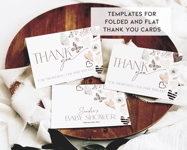 May include: Three thank you cards with a watercolor floral design featuring butterflies and hearts. The cards say "Thank you for showering our baby with love". One card also includes the text "Sandra's Baby Shower February 14th, 20xx".
