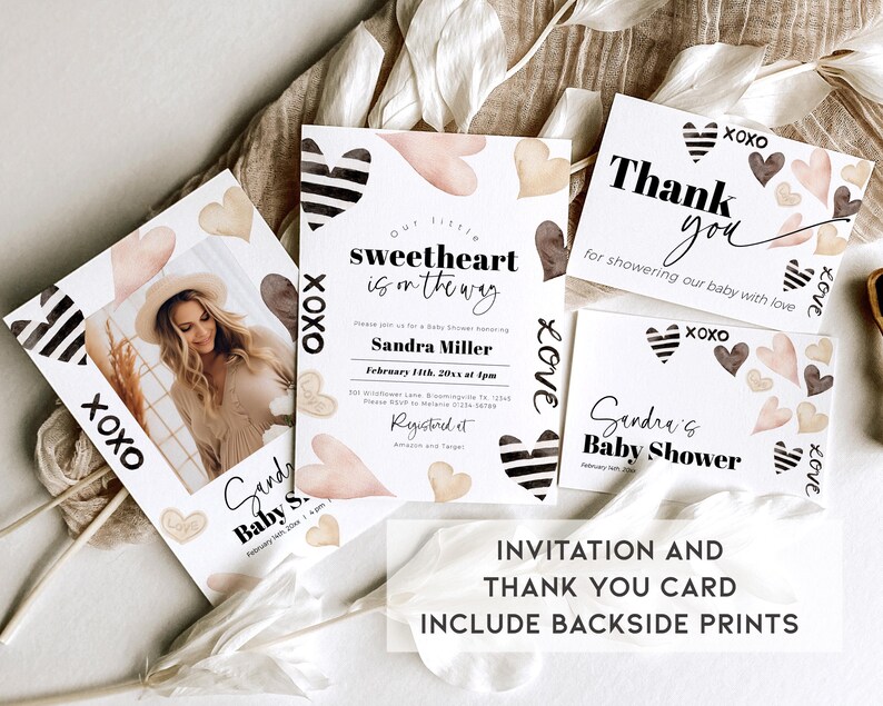 May include: A set of two printable baby shower cards with a watercolour heart design. The invitation card features the text "Our little sweetheart is on the way" and the thank you card features the text "Thank you for showering our baby with love".