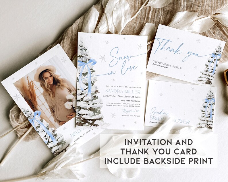 May include: A winter-themed bridal shower invitation and thank you card set. The invitation features a watercolor illustration of a snowy pine tree with a blue ribbon and the text "Snow in Love". The thank you card features the same illustration and the text "Thank you".