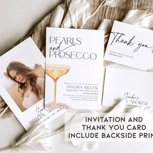 May include: Invitation and thank you card set for a bridal shower. The invitation features a glass of champagne and the text "Pearls and Prosecco". The thank you card features a glass of champagne and the text "Thank you".
