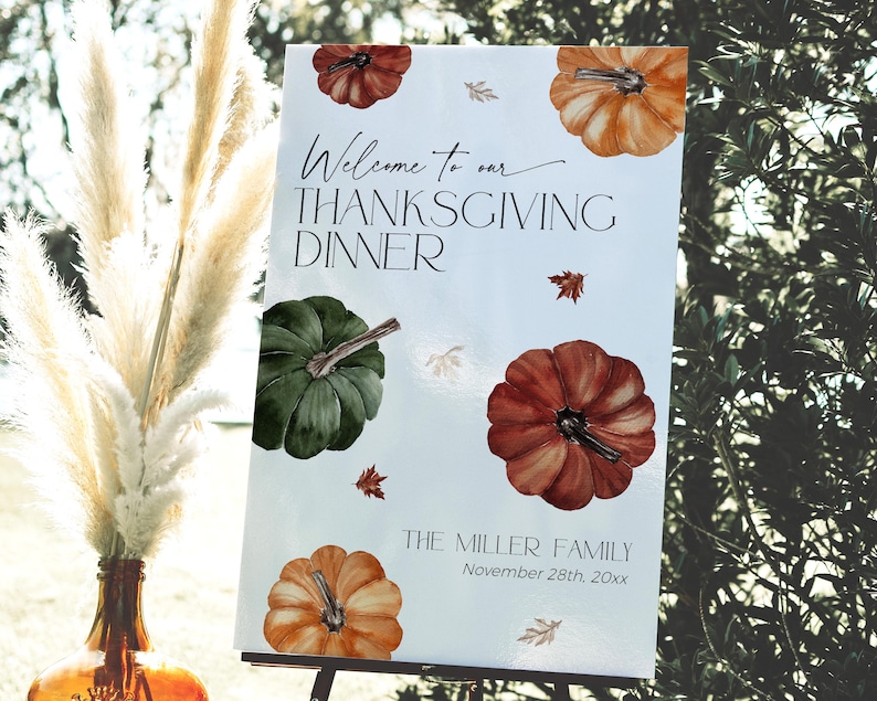 May include: Thanksgiving dinner welcome sign with watercolor pumpkins in orange, green, and red. The sign includes the text "Welcome to our Thanksgiving Dinner" and family name and date.
