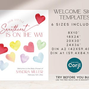 May include: A welcome sign template for a baby shower with the text "Our Little Sweetheart Is On The Way". The sign features a watercolor design with hearts in various colors, including red, yellow, green, blue, and pink. The sign also includes the text "Welcome to the Baby Shower of Sandra Miller, February 14th, 20xx".