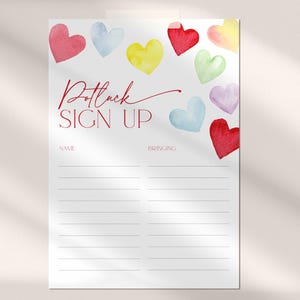 May include: A white sign with the text "Potluck Sign Up" in red cursive lettering. The sign has two columns labeled "Name" and "Bringing". The sign is decorated with watercolor hearts in various colors, including red, yellow, blue, green, and pink.