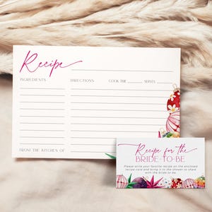 May include: A printable recipe card with a pink and white watercolor design of Christmas ornaments. The card says "Recipe for the Bride-to-Be" and includes instructions to write a favorite recipe on the card and bring it to the bridal shower.