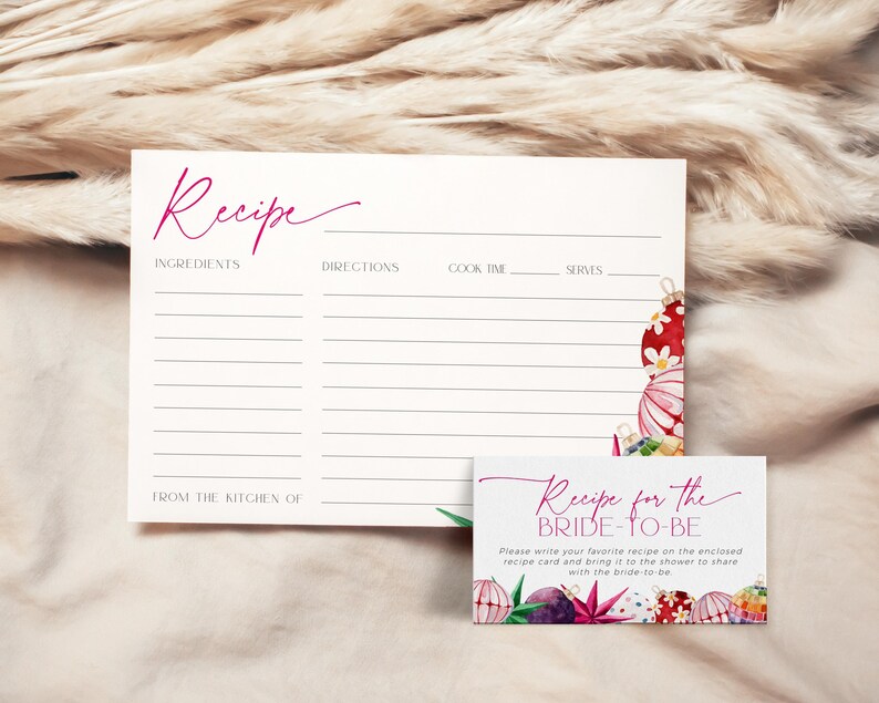 May include: A printable recipe card with a pink and white watercolor design of Christmas ornaments. The card says "Recipe for the Bride-to-Be" and includes instructions to write a favorite recipe on the card and bring it to the bridal shower.
