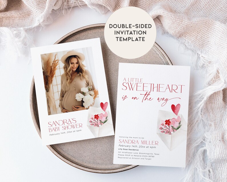 May include: Double-sided baby shower invitation template featuring a watercolour illustration of a pink and red envelope with flowers and a heart. The text on the front reads "A little sweetheart is on the way". The back of the invitation features a photo of a pregnant woman in a beige dress and a floral bouquet. The text on the back reads "Sandra's Baby Shower, February 14th, 20xx at 4pm".