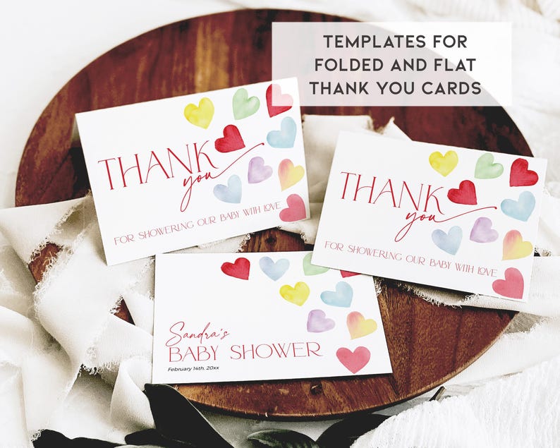 May include: Three printable thank you cards with watercolor hearts in shades of pink, yellow, blue, and green. The cards say "Thank you for showering our baby with love".
