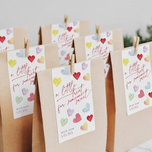 May include: A set of brown paper bags with colorful heart-shaped stickers that say "a little treat for someone sweet" and "with love SANDRA".