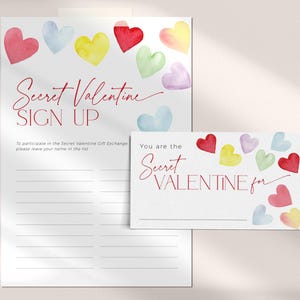Pode incluir: Uma folha de inscri&ccedil;&atilde;o imprim&iacute;vel para uma troca de presentes Secret Valentine. A folha apresenta um desenho de aquarela de cora&ccedil;&otilde;es coloridos e o texto "Secret Valentine Sign Up". H&aacute; um cart&atilde;o menor que diz "Voc&ecirc; &eacute; o Secret Valentine para".