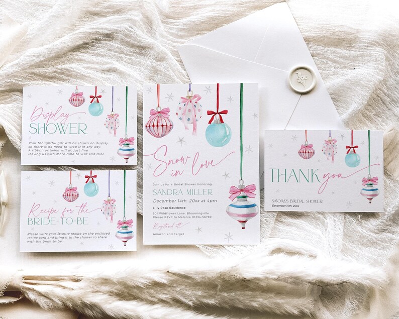 May include: A set of four printable cards for a bridal shower with a winter theme. The cards feature a watercolor illustration of pink and blue ornaments with snowflakes and the text "Display Shower", "Recipe for the Bride-to-Be", "Snow in Love", and "Thank You".